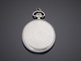 an antique silver pocket watch with a chain on a black background