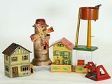 une petite collection de maisons miniatures et un moulin à vent