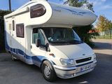 an image of a motor home parked in a parking lot