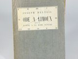 an old book sitting on top of a white table next to a white wall