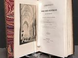 un livre ouvert dans lequel figure l'image d'une église