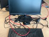 a desk with a keyboard and a monitor on it