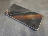 a close up of a cell phone on a table