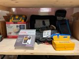 a shelf that has a bunch of electronics on it