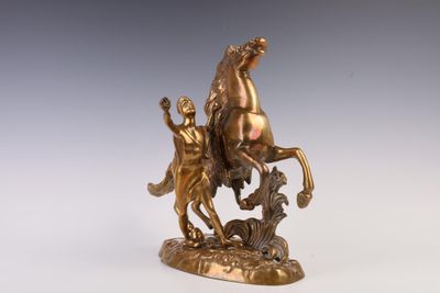 bronze statue of a man on a horse with a woman on a horse