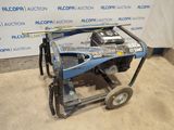 an image of a blue and black machine sitting on top of a cart