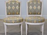 pair of louis xvi style painted chairs with upholstered cushions