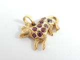 a picture of a giraffe charm on a white surface