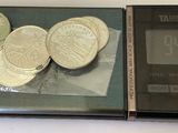 a picture of a scale with some coins on it