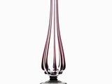 a glass vase that is sitting on a table