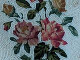 a picture of a beaded purse with roses on it