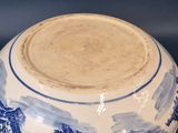 a blue and white bowl sitting on a table