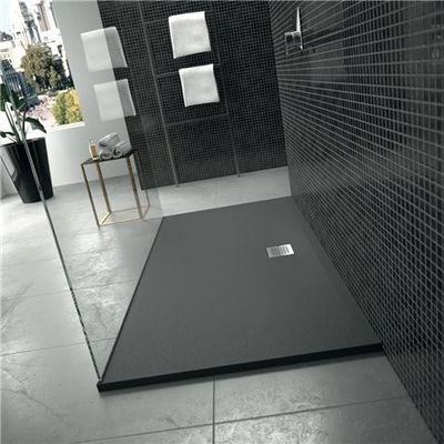a black and white photo of a bathroom with a walk in shower