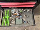 many tools in a tool box on the floor