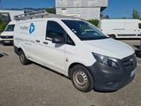 a white van that is parked in a parking lot
