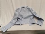 the jacket is blue and has buttons on the collar