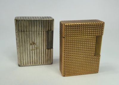 two lighters sitting side by side on a white surface