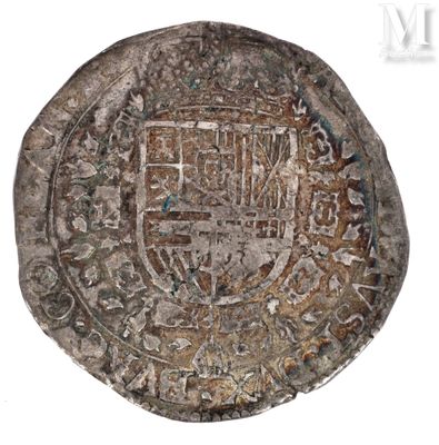 a close up of a coin with a coat of arms on it