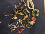 a lot of jewelry that is laying out on the table