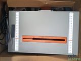 a box with a computer inside of it on a table