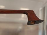 a close up of a wooden handle on a glass door