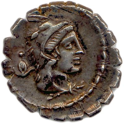 gros plan d'une pièce de monnaie sur laquelle figure un visage de femme