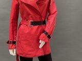 an image of a mannequin dressed in a red coat and black leggings