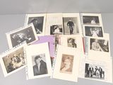 several old black and white photographs of people on a table