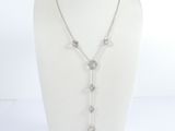a close up of a necklace on a mannequin mannequin