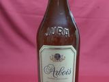 an image of a bottle of alcohol sitting on a table