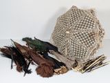 a lot of feathers and a net bag on the table