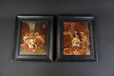 two framed paintings of a man and a woman sitting on a couch