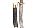 two knives with gold and black handles on a white background