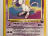 a close up of a pokemon card with a cat on it