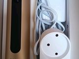 a box with a remote control and a charger in it