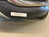 the front bumper of a car with a sticker on it