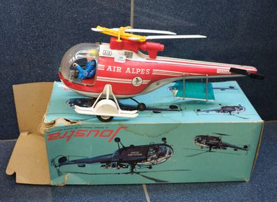 a toy helicopter that is sitting on top of a box