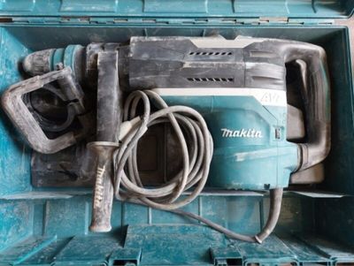 a blue box with a hammer and a cord in it