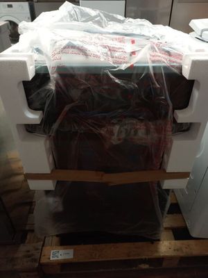 a microwave sitting on top of a pallet in a kitchen