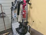 a machine that is sitting in a garage next to a wall