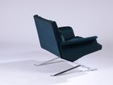a blue chair that is sitting on a metal stand