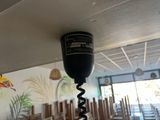 a wine bottle that is connected to a corkscrew