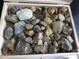 a box full of rocks and stones on a table