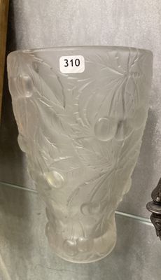 a glass vase that has a sticker on the side of it