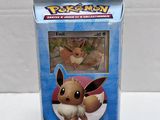 a close up of a box of pokemon cards on a table