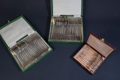 a box of silverware sitting on a table next to a box of silverware