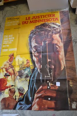 movie poster of a man holding a gun in front of a wall