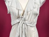 this image may contain a mannequin and a dress on a mannequin stand