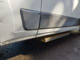 a close up of the side of a van with the door open