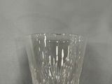 a glass vase that is sitting on a table